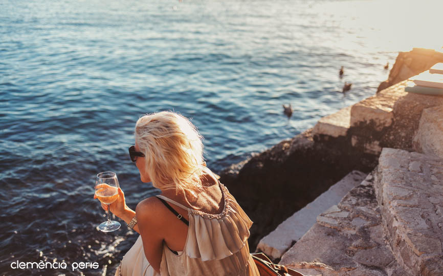 Woman Drinking Wine by the Sea